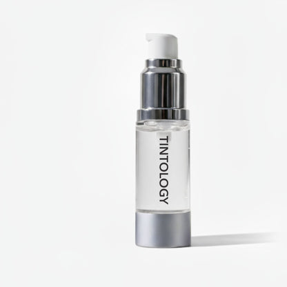 Tintology fusion brow gel with silver cap and white label on a light gray background