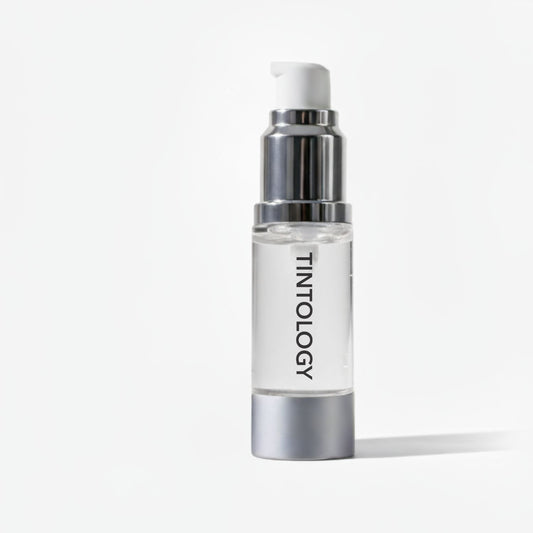 Tintology fusion brow gel with silver cap and white label on a light gray background
