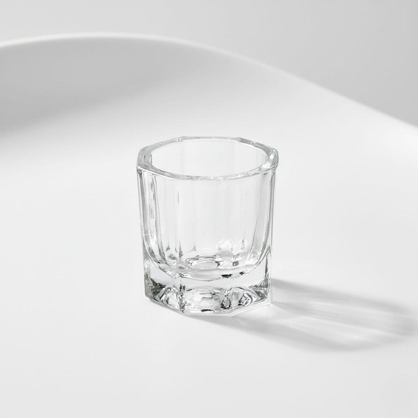 Close-up, isolated shot of the small, glass mixing dish used to blend the G2 Fuse Activator Gel and the True Tone Pigment together.