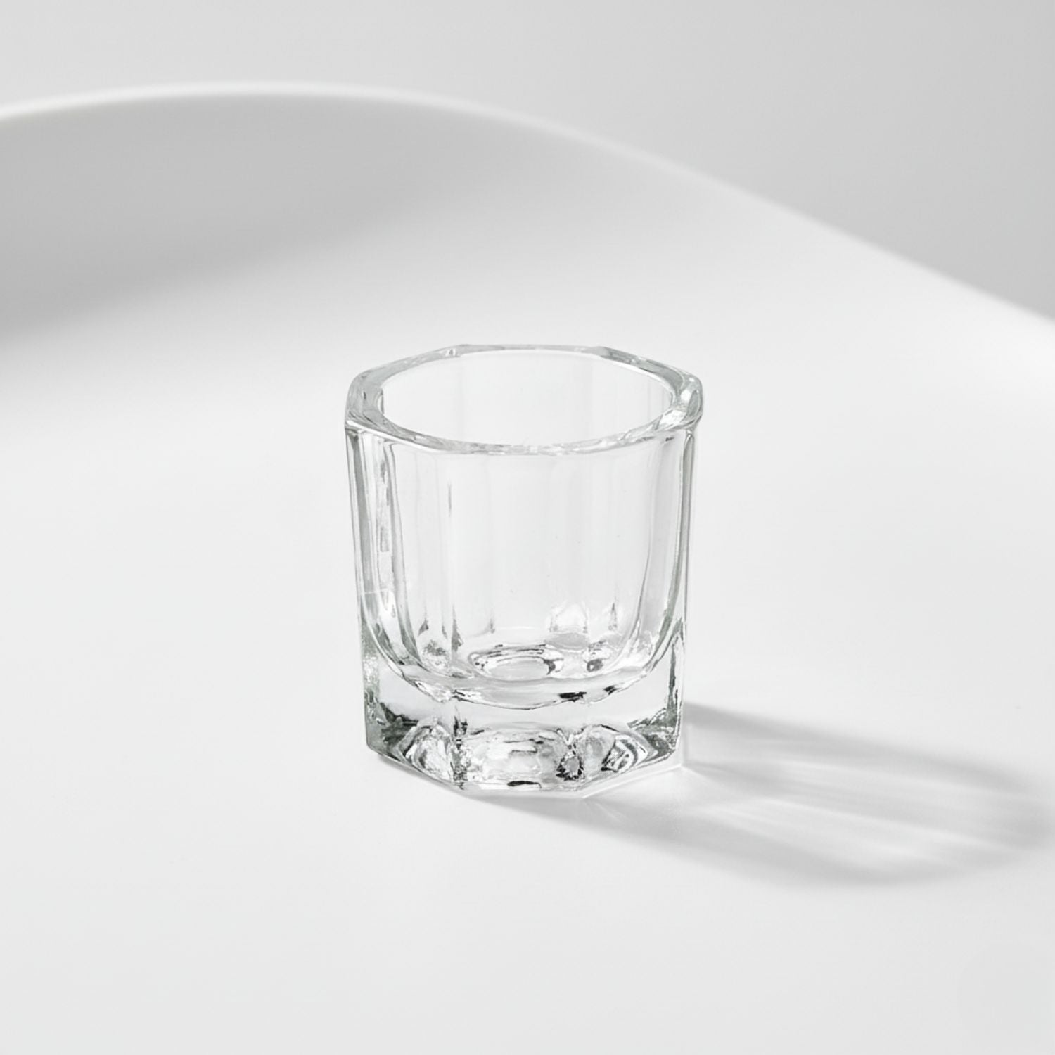 Close-up, isolated shot of the small, glass mixing dish used to blend the G2 Fuse Activator Gel and the True Tone Pigment together.