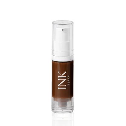 INK liquid-to-powder brow pigment in shade TERRA, clear airless pump bottle on a white background